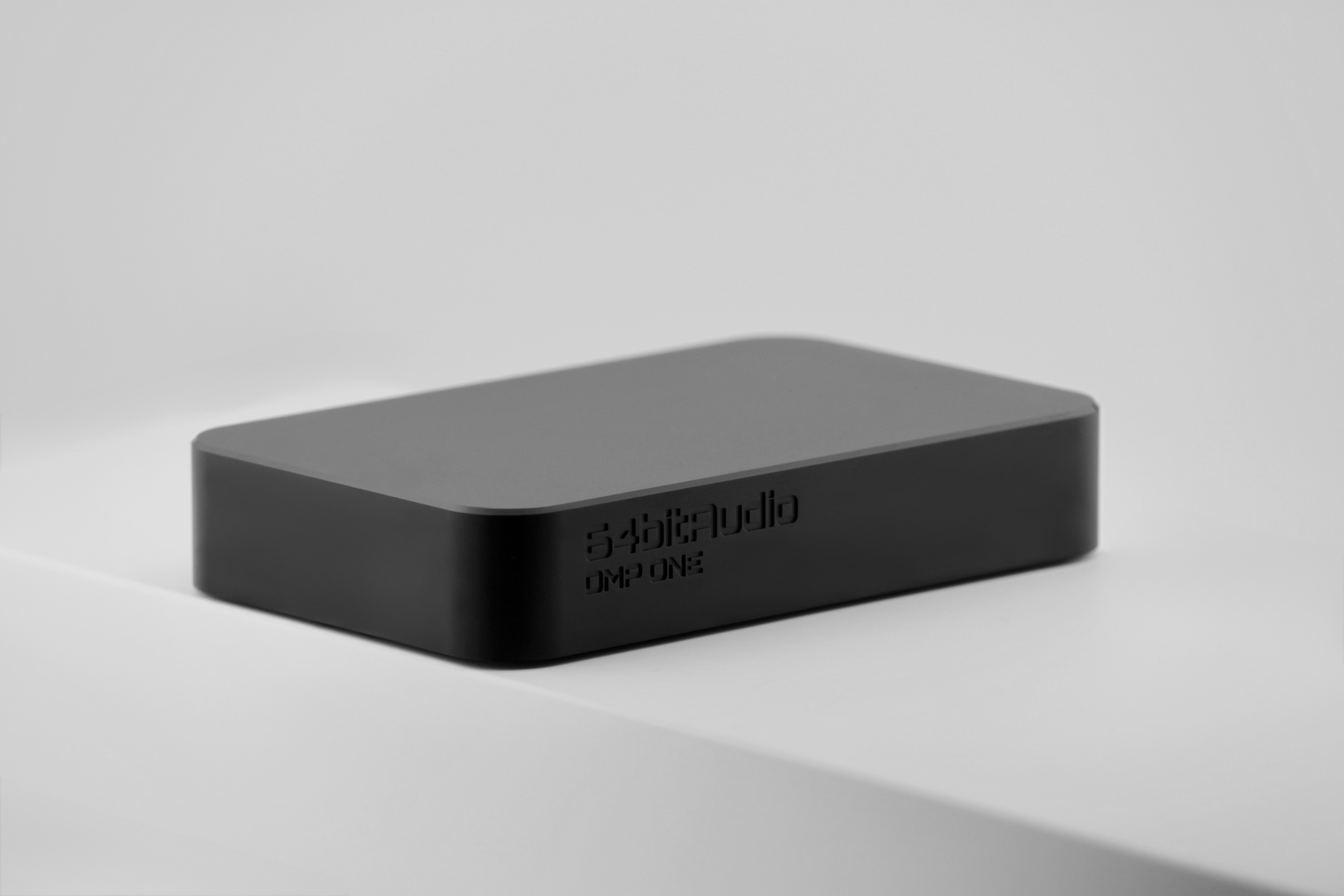 DMP ONE — Black anodized, three-quarter view